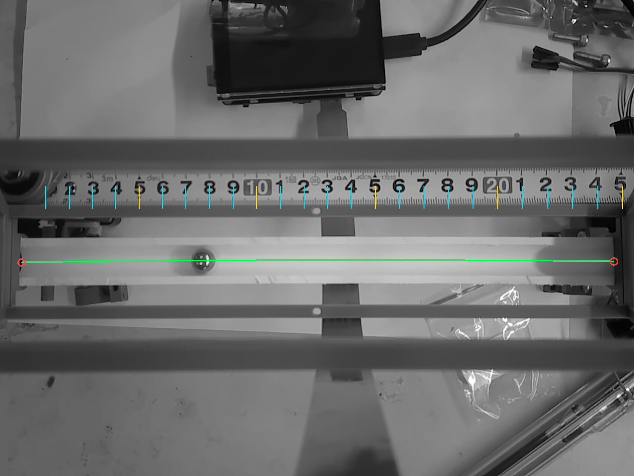 CanMV K230 grayscale view showing the calibrated beam centerline and detected steel ball